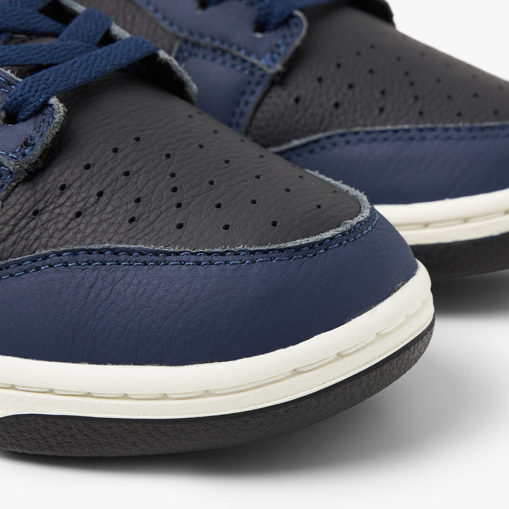 Navy blue shop and yellow nikes