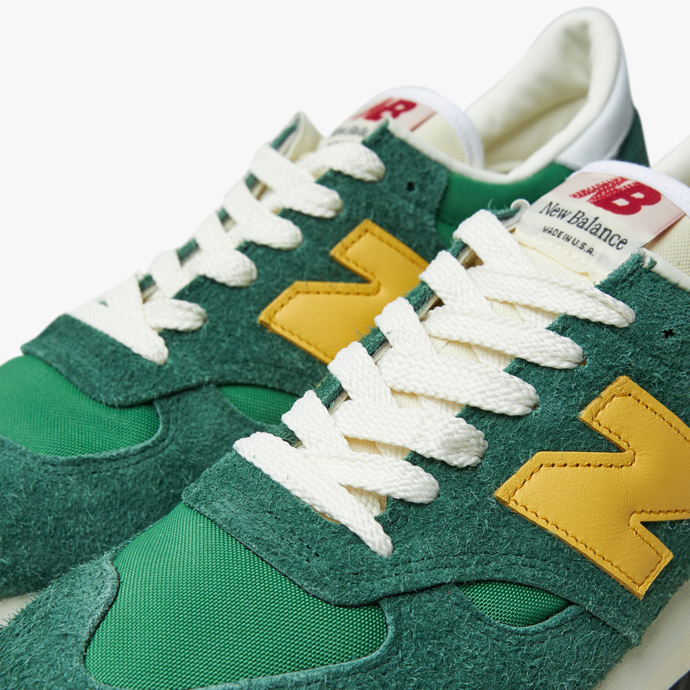 Green and gold new balance top